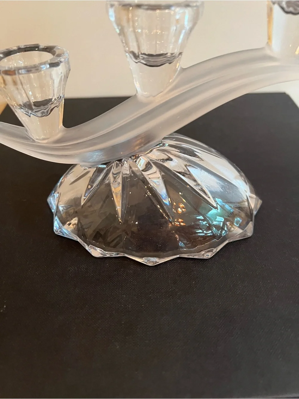 Glass candle holder Features a unique asymmetrical 